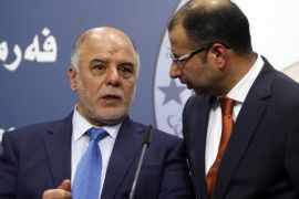 Salim al-Jabouri (R), new speaker of the Iraqi Council of Representatives, and Shi'ite deputy speaker Haidar Abadi (L), a member of Iraqi Prime Minister Nuri al-Maliki's State of Law bloc, speak during a news conference in Baghdad, July 15, 2014. Iraqi politicians named Jabouri, a moderate Sunni Islamist, as speaker of parliament on Tuesday, a long-delayed first step towards a power-sharing government urgently needed to save the state from disintegration in the face of a Sunni uprising. REUTERS/Ahmed Saad (IRAQ - Tags: POLITICS)