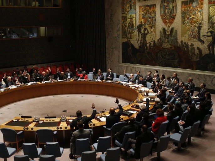 The United Nations Security Council votes in favor of a resolution demanding the Houthi militia's withdrawal from Yemeni government institutions, during a meeting of the Council at the U.N. headquarters in New York, February 15, 2015. The United Nations Security Council on Sunday demanded Iranian-backed Houthi militia in Yemen withdraw from government institutions, called for an end to foreign interference and threatened "further steps" if the violence does not stop. The United Nations has warned that Yemen is collapsing. Shi'ite Muslim Houthi fighters have sidelined the central government after seizing the capital Sanaa in September and expanding across Yemen. REUTERS/Mike Segar (UNITED STATES - Tags: POLITICS CIVIL UNREST) CONFLICT)