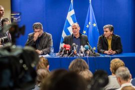 Greece's Finance Minister Yanis Varoufakis, 2nd right, addresses the media after a meeting of Eurogroup finance ministers at the EU Council building in Brussels on Monday, Feb. 16, 2015. Greece’s radical left government and its European creditors headed into new talks Monday on the debt-heavy country’s stuttering bailout program, but expectations are low despite a fast-approaching deadline for some kind of deal. (AP Photo/Geert Vanden Wijngaert)