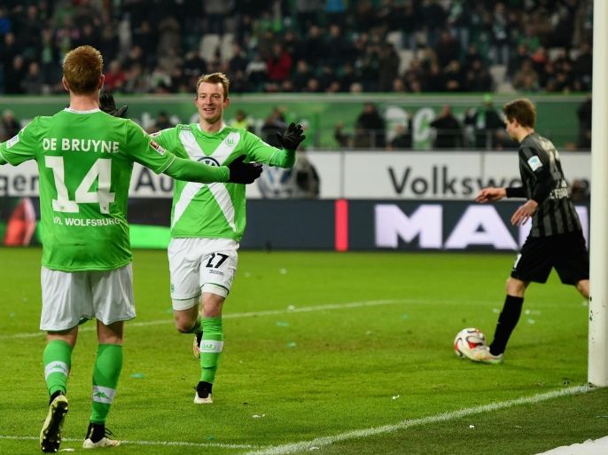 WOLFSBURG, GERMANY - MARCH 15: Maximilian Arnold of VfL Wolfsburg celebrates as he scores the third goal during the Bundesliga match between VfL Wolfsburg and SC Freiburg at Volkswagen Arena on March 15, 2015 in Wolfsburg, Germany.