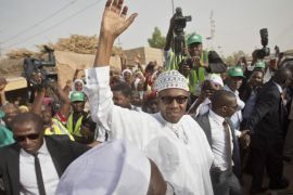 Opposition candidate Gen. Muhammadu Buhari waves to supporters after casting his vote in his home town of Daura, northern Nigeria Saturday, March 28, 2015. Nigerians went to the polls Saturday in presidential elections which analysts say will be the most tightly contested in the history of Africa's richest nation and its largest democracy. (AP Photo/Ben Curtis)