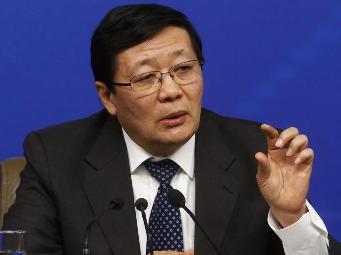Chinese Finance Minister Lou Jiwei gestures during a press conference on the sidelines of the ongoing Third Session of the 12th National People's Congress (NPC) in Beijing, China, 06 March 2015. A budget report from the Ministry of Finance on 05 March said China planned to increase its military budget this year by 10.1 percent, bringing the total defense budget to about 145 billion dollars (131 billion euro).