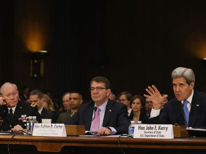 WASHINGTON, DC - MARCH 11: Secretary of State John Kerry (R) testifies while flanked by Defense Secretary Ashton Carter (C) and Chairman of the Joint Chiefs of Staff Gen. Martin Dempsey (L) during a Senate Foreign Relations Committee hearing on Capitol Hill, March 11, 2015 in Washington, DC. The committee is hearing testimony from top administration officials on President Obamas request to Congress for authorization to use force against ISIS.