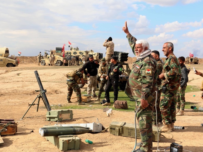 ‪عناصر من الجيش العراقي والقوات المتحالفة معه قرب تكريت‬ (أسوشيتد برس)