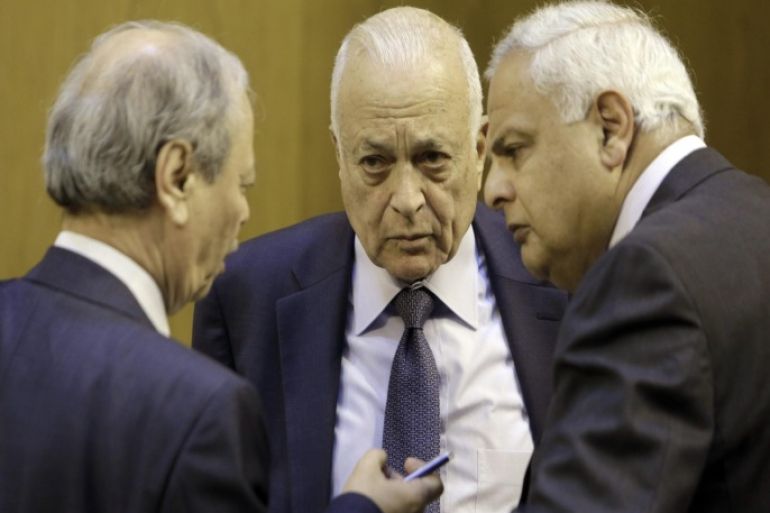 Arab League Secretary-General Nabil Elaraby, center, listens to his deputy Ahmed Ben Helli, left, during an Arab foreign ministers meeting at the Arab League headquarters in Cairo, Egypt, Monday, March 9, 2015. Arab ministers met to prepare for an upcoming Arab Summit meeting, that is scheduled to take place at the end of March in Sharm el-Sheikh, Egypt. (AP Photo/Amr Nabil)