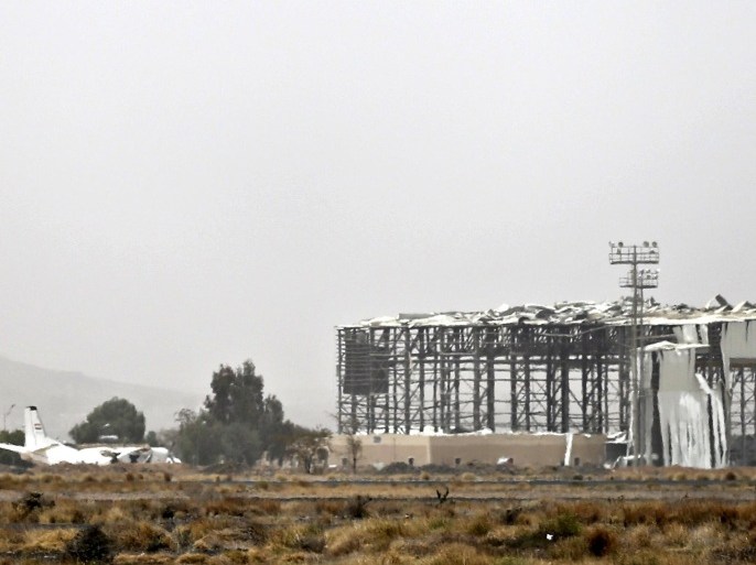 A building damaged by an air strike is seen at an air base near Sanaa Airport March 28, 2015. An Arab alliance attacking Shi'ite Muslim Houthi forces in Yemen initially plans a month-long campaign, but the operation could last five or six months, a Gulf diplomatic official said on Saturday. REUTERS/Khaled Abdullah