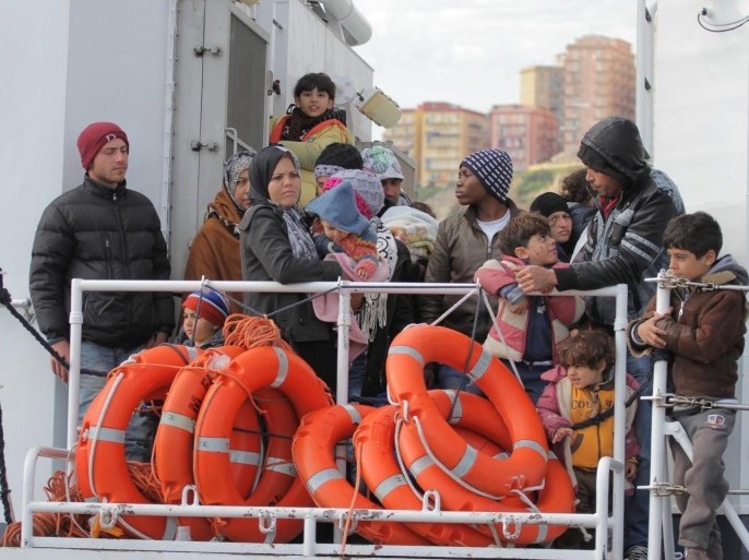 Rescued migrants disembark from an Italian Coast Guard vessel in Porto Empedocle, Sicily island, southern Italy, 04 March 2015. Ten migrants were found dead and 941 survivors were picked up in several rescue operations conducted over the past 24 hours off the coast of Libya, the Italian coast guard said 04 March.