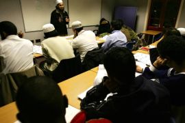 LONDON - DECEMBER 8: A British muslim teacher, Mujahid Ali (3rd-L), teaches British muslim students an Arabic language lesson, during an evening class in Ebrahim Community College December 8, 2004 in London, England. According to UK National Statistics, there are about two million Muslims living in the United Kingdom.