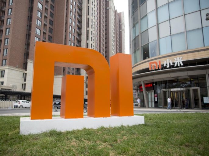 The Xiaomi Corp. logo stands outside the company's headquarters in Beijing, China, on Friday, Sept. 12, 2014. Xiaomi Chief Executive Officer Lei Jun plans to boost global smartphone sales fivefold to 100 million units next year.