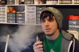 In this Jan. 13, 2015 photo, Tyler Newman, 24, vapes during his managing shift at the Madison, Wis., e-cigarette shop Infinite Vapor. Lawmakers will reignite conversations this week about whether vaping _ using electronic cigarettes and other vapor smoking devices _ should be included in Wisconsin’s smoking ban. (AP Photo/Dana Ferguson)
