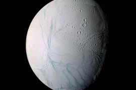 This June 28, 2009 image provided by NASA, taken by the international Cassini spacecraft, shows Enceladus, one of Saturn’s moons. A new study published online Wednesday, March 11, 2015, in the journal Nature, suggests there are ongoing interactions between hot water and rocks beneath the surface of the icy moon. (AP Photo/NASA)
