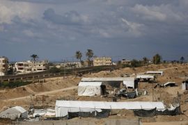 A general view shows the entrances of deactivated tunnels which linked the Palestinian Gaza Strip to the Egyptian town of Rafah, on October 30, 2014. Egypt began setting up a buffer zone along the border with the Hamas-run territory to prevent militant infiltration and arms smuggling following a wave of deadly attacks. The move, which is set to result in the demolition of hundreds of homes, comes after a suicide bombing in the Sinai Peninsula killed at least 30 soldiers last week. AFP PHOTO/MOHAMMED ABED