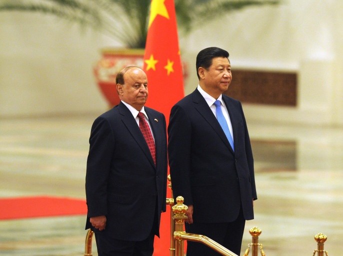 Yemeni President Abdrabuh Mansur Hadi (L) and Chinese President Xi Jinping (R) prepare to inspect Chinese hornour guards during a welcome ceremony at the Great Hall of the People in Beijing on November 13, 2013. President Abdrabuh Mansur Hadi is on an official visit to China from November 12 to 15. AFP PHOTO / WANG ZHAO