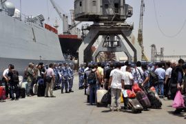 Chinese people standing beside their luggage wait for an evacuation from Yemen at a sea port in the western port city of Hodeidah, Yemen, 30 March 2015. Chinese Defense Ministry said on 30 March it was sending a naval fleet to help evacuate its citizens from Yemen as the conflict worsens. The government made the decision after Saudi Arabia launched airstrikes on its southern neighbor last week.