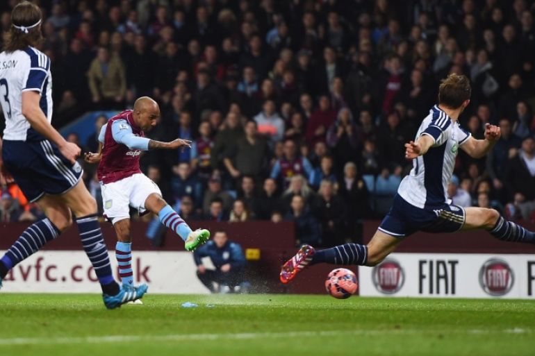 BIRMINGHAM, ENGLAND - MARCH 07: Fabian Delph of Aston Villa shoots past Craig Dawson of West Bromwich Albion to score their first goal during the FA Cup Quarter Final match between Aston Villa and West Bromwich Albion at Villa Park on March 7, 2015 in Birmingham, England.