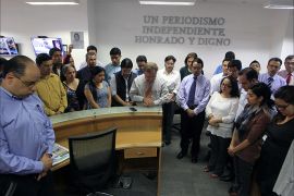 Journalist of Prensa Libre newspaper hold a one-minute silence in hommage of their teammate Danilo Lopez in Guatemala City on March 10, 2015