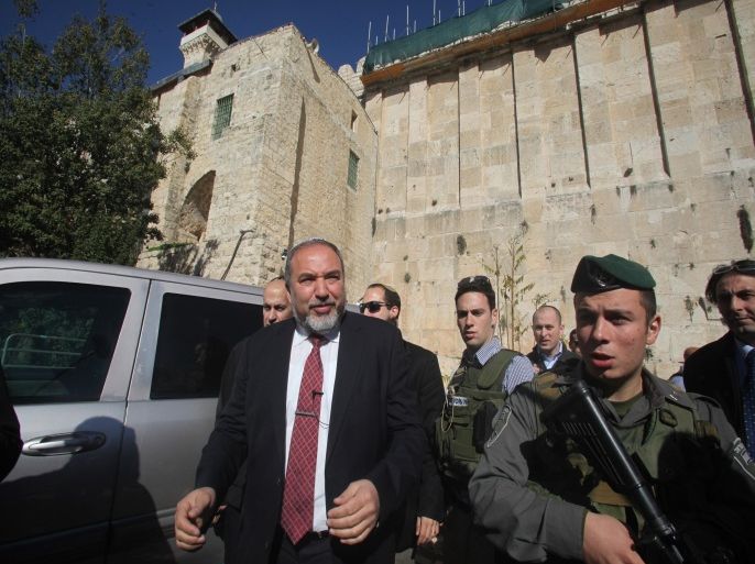 Former Israel Minister for Foreign Affairs Avigdor Liberman is seen near the Ibrahimi Mosque, a holy site to both Muslims and Jews who refer to it as the Tombs of the Patriarchs, in the old quarter of the southern West Bank city of Hebron on January 14, 2013, during his campaign visit to the divided city to meet Israeli settlers in the Kiryat Arbaa settlement and in the settlers zones in the center of the city. Israel goes to the polls on January 22.