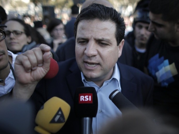 Israeli Arab political leader and leader of a joint list of Arab parties for the upcoming election, Ayman Odeh answers journalists' questions during a campaign meeting on March 14, 2015 in the Jaffa district of Tel Aviv. AFP PHOTO / AHMAD GHARABLI