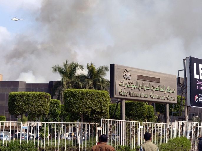 Some rises from the Cairo Conference Center after fire broke out, in Cairo, Egypt, 04 March 2015. A fire broke out at the Cairo International Convention Centre in Nasr City district on 04 March. Firefighters are trying to contain the blaze using dozen of fire-engines and an army helicopter. No casualties were reports and the cause of the fire remains unclear. EPA/BASMA FATHI/ALMASRY ALYOUM EGYPT OUT