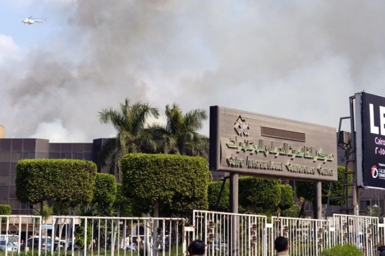 Some rises from the Cairo Conference Center after fire broke out, in Cairo, Egypt, 04 March 2015. A fire broke out at the Cairo International Convention Centre in Nasr City district on 04 March. Firefighters are trying to contain the blaze using dozen of fire-engines and an army helicopter. No casualties were reports and the cause of the fire remains unclear. EPA/BASMA FATHI/ALMASRY ALYOUM EGYPT OUT