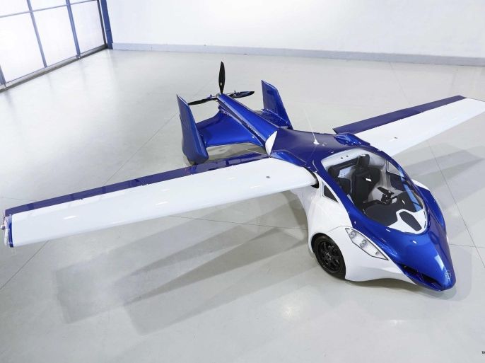 The AeroMobil 3.0 is pictured in a garage in Slovakia in this handout provided by Aeromobil October, 2014. The "Flying Roadster", a unique prototype, combines the qualities of a supercar and a light sports aircraft. According to a press release the AeroMobil has a top speed of 160 km/h (100 mph) as a car and 200km/h (124 mph) as a plane. The range is about 700 km (430 miles) as a plane and 875 km (540 miles) as a car. It has two seats, uses regular petrol and can be used in road traffic as well as at any airport in the world. REUTERS/AeroMobil/Handout via Reuters (AUSTRIA - Tags: SOCIETY TRANSPORT BUSINESS) ATTENTION EDITORS - THIS PICTURE WAS PROVIDED BY A THIRD PARTY. REUTERS IS UNABLE TO INDEPENDENTLY VERIFY THE AUTHENTICITY, CONTENT, LOCATION OR DATE OF THIS IMAGE. FOR EDITORIAL USE ONLY. NOT FOR SALE FOR MARKETING OR ADVERTISING CAMPAIGNS. NO SALES. NO ARCHIVES. THIS PICTURE IS DISTRIBUTED EXACTLY AS RECEIVED BY REUTERS, AS A SERVICE TO CLIENTS