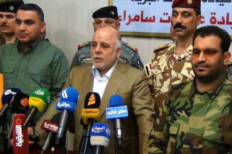 A picture made available on 02 March 2015 shows Iraqi Prime Minister, Haider al-Abadi (C) speaking to media at Samara operation command in Samara city, northern Iraq, 01 March 2015. Iraqi Prime Minister Haider al-Abadi announced on 01 March from Samara city that the security operation to liberate the rest of the areas in Salahuddin from the Islamic State (IS) group militants has begun in the province. Iraqi security forces backed up by militias and tribal fighters launched on 02 March what they said was a major offensive aimed at recapturing the city of Tikrit and other areas north of Baghdad from Islamic State.