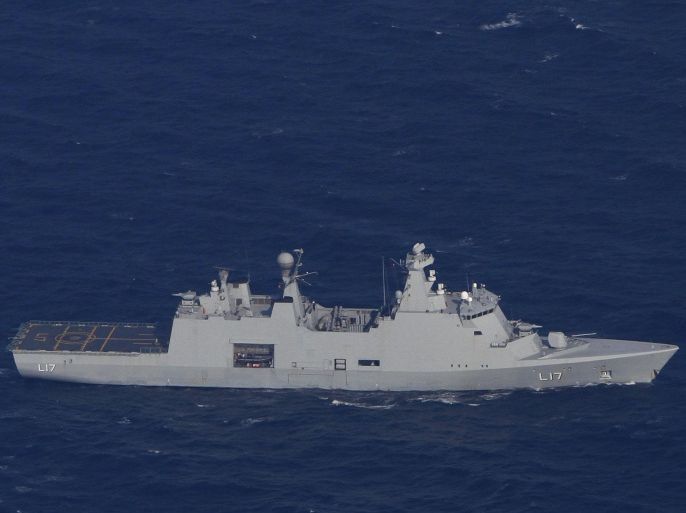 The Danish war ship "Esbern Snare" is seen from above in the sea between Cyprus and Syria, Saturday, Jan. 4, 2014. Two cargo ships and their warship escorts will set sail Friday from the Cypriot port of Limassol to waters near Syria where they will wait for orders on when they can head to the Syrian port of Latakia to pick up more than 1,000 tons of chemical agents. (AP Photo/Petros Karadjias)
