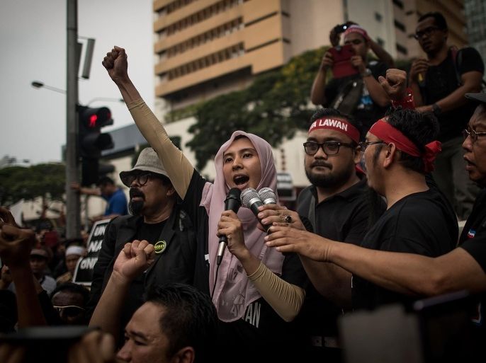 KUALA LUMPUR, MALAYSIA - MARCH 07: Daughter of Anwar Ibrahim Nurul Izzah speaks to supporters on a street outside of Sogo on March 7, 2015 in Kuala Lumpur, Malaysia. Anwar Ibrahim was sentenced for five years in prison on Feb. 10, 2015 for sodomizing his former male aide.