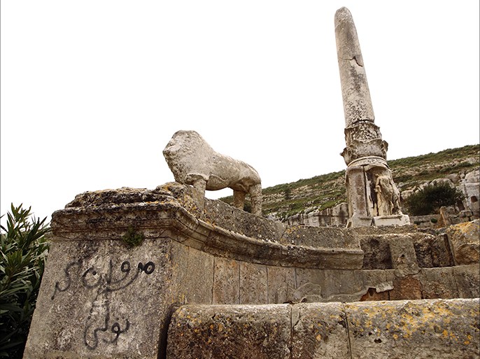 A picture taken on March 16, 2015 shows a damaged statue view of the ruins of the ancient Greek city of Cyrene, a colony of the Greeks of Thera (Santorini) and a principal city in the Hellenic world founded in 630 BC, located in the suburbs of the Libyan eastern town of Shahat, east of Benghazi. Cyrene is listed by UNESCO as a World Heritage site