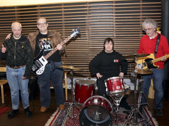 Members of the Finnish punk band Pertti Kurikan Nimipaivat (L-R) Kari Aalto, Sami Helle, Toni Valitalo and Pertti Kurikka pose for a picture in their rehearsal room in Helsinki March 6, 2015. Kurikka, 58, wants to make it perfectly clear that while he and the other members of his Eurovision contestant Finnish band have disabilities, they know how to rock. Last month they won a popular vote to represent Finland in the Vienna finals and have since been touted as one of the favorites to follow Austrian drag queen Conchita Wurst's triumph last year. REUTERS/Attila Cser (FINLAND - Tags: ENTERTAINMENT SOCIETY)
