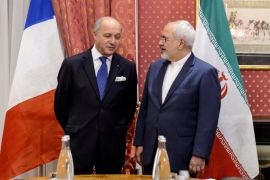 French Foreign Minister Laurent Fabius (L) speaks with his Iranian counterpart Mohammad Javad Zarif at the opening of a bilateral meeting on nuclear talks on March 28, 2015 in Lausanne. Fabius joined US Secretary of State John Kerry and their Iranian counterpart Mohammad Javad Zarif ahead of a March 31 deadline to agree the contours of what they hope with be a historic agreement.  AFP PHOTO / FABRICE COFFRINI