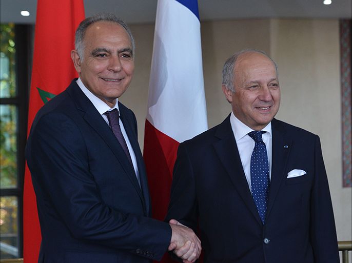 epa04655066 French Foreign Minister, Laurent Fabius (R), shakes hands with his Moroccan counterpart, Salaheddine Mezouar (L), in Rabat, 09 March 2015. Fabius is on a two day visit to the north African country in yet another high profile visit between the two countries following a thawing in their relations, for talks which he said would focus on cooperation, the economy and countering rising terrorism. EPA/ABDELHAK SENNA