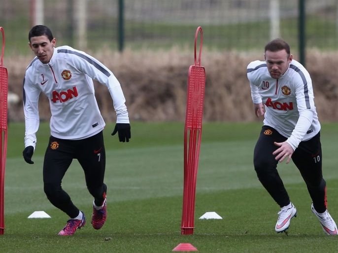 MANCHESTER, ENGLAND - FEBRUARY 20: (EXCLUSIVE COVERAGE) Angel di Maria and Wayne Rooney of Manchester United in action during a first team training session a first team training session at Aon Training Complex on February 20, 2015 in Manchester, England.