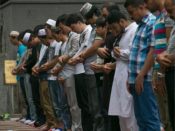 epa04297619 Muslim faithful conduct Friday prayers one week into the observance of Ramadan at the Niujie Mosque in Beijing, China 04 July 2014. More than a billion Muslims across the world observe Ramadan as an integral part of their faith. It is said by Islamic scholars to be the month in which God began revealing the Koran to the prophet Mohammed. EPA/ROLEX DELA PENA