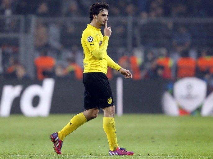 Dortmund's Mats Hummels gestures during the Champions League round of 16 second leg soccer match between Borussia Dortmund and Juventus Turin on Wednesday, March 18, 2015 in Dortmund, Germany. (AP Photo/Frank Augstein)