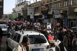 SANAA, YEMEN - MARCH 04: A group of people hold banners as they march during a demonstration against Shiite Houthi movement that interfere to the country's government, at Zubairi Street in Sanaa, Yemen on March 04, 2015. Protesters chant slogans demanding release of the protester took under custody during previous demonstrations.