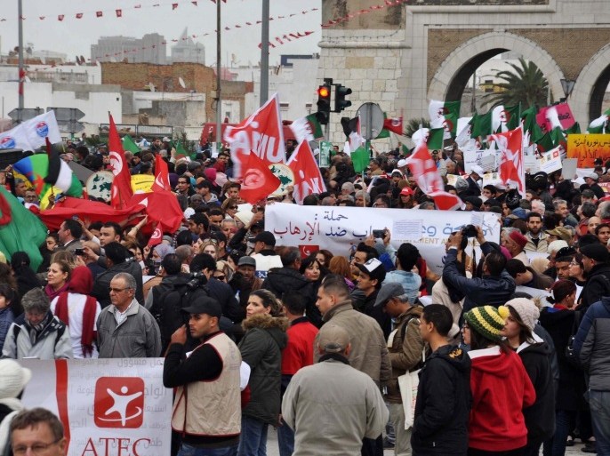 People from the World Social Forum gather to denounce terror, Tunis, Tunisia, 24 March 2015. The World Social Forum gathered in Tunis for an event criticising the capitalist system, but due to the 18 March attack which left 20 foreigners and two Tunisians dead when gunmen opened fire on visitors at the National Bardo Museum in Tunis, some of the 70'000 delegates expected to attend the event decided to organise a march culminating at the museum showing support for Tunisia and against terror.
