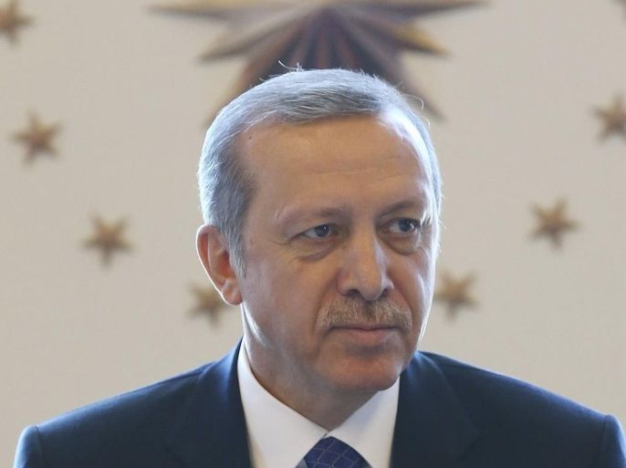 Turkey's Pesident Tayyip Erdogan addresses the provincial governors of Turkey during a meeting at the Presidential Palace in Ankara February 27, 2015. Turkish Central Bank Governor Erdem Basci sought to calm jittery investors on Friday, dismissing rumours that he would resign and giving a brief lift to the lira currency after it tumbled to a record low.Basci's future, and the independence of the central bank, have been a concern for investors since President Tayyip Erdogan stepped up criticism of the bank this week after it failed to meet his demand for bigger rate cuts. Speaking at a lunch for provincial governors on Friday, Erdogan did not mention the bank's latest rate decision but repeated his view that high interest rates amounted to a betrayal of the nation. REUTERS/Kayhan Ozer/Presidential Palace Press Office/Handout via Reuters (TURKEY - Tags: POLITICS) RELIGION) ATTENTION EDITORS - NO SALES. NO ARCHIVES. FOR EDITORIAL USE ONLY. NOT FOR SALE FOR MARKETING OR ADVERTISING CAMPAIGNS. THIS IMAGE HAS BEEN SUPPLIED BY A THIRD PARTY. IT IS DISTRIBUTED, EXACTLY AS RECEIVED BY REUTERS, AS A SERVICE TO CLIENTS