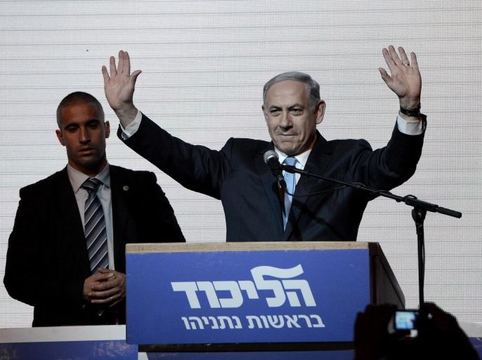 TEL AVIV, ISRAEL - MARCH 18: Israeli Prime Minister and the leader of the Likud Party Benjamin Netanyahu greets supporters at the party's election headquarters after the first results of the Israeli general election on March 18, 2015 in Tel Aviv, Israel.