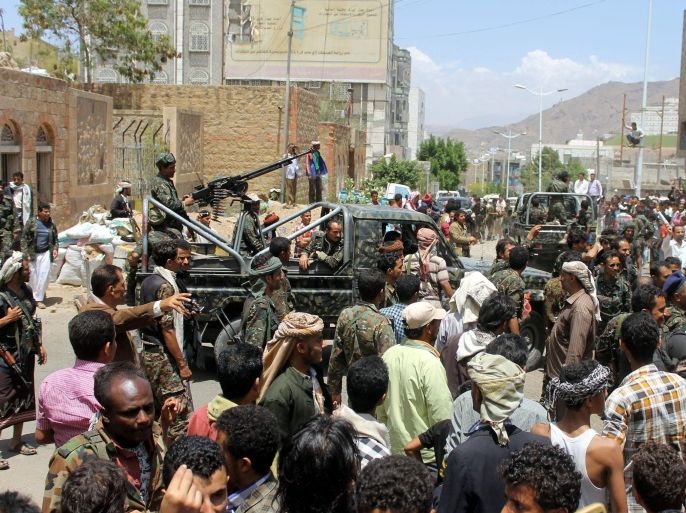 TAIZ, YEMEN - MARCH 21: Security forces intervene Yemeni protestors as they protest against Houthis in front of Special forces quarters in Taiz, Yemen on March 21, 2015.