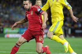 SEVILLE, SPAIN - MARCH 27: Jordi Alba of Spain gets past Andriy Yarmolenko of Ukraine during the Spain v Ukraine EURO 2016 Qualifier at Estadio Ramon Sanchez Pizjuan on March 27, 2015 in Seville, Spain.