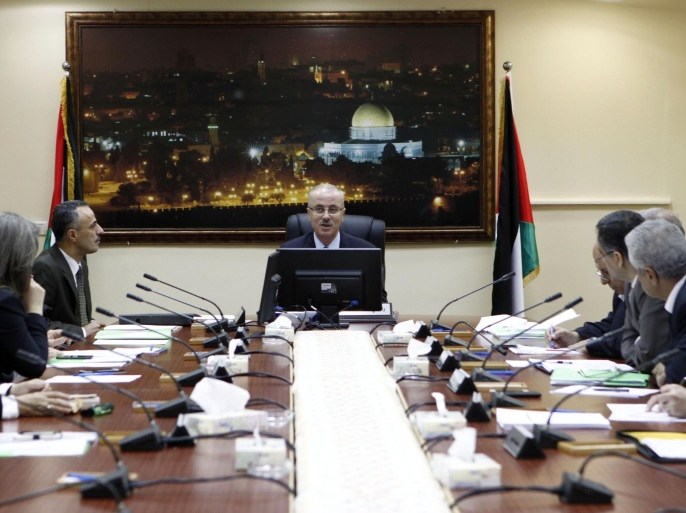 RAMALLAH, WEST BANK - JULY 15: Palestinian Prime Minister Rami Hamdallah (C) and Palestine ministerial cabinet take kindly of Egypt's ceasefire proposes which allows for talks which both sides considering it.