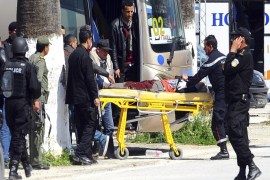 A victim is being evacuated from the Bardo museum are evacuated in Tunis, Wednesday, March 18, 2015 in Tunis, Tunisia after gunmen opened fire at the leading museum in Tunisia's capital. Tunisia's prime minister says 21 people are dead after an attack on a major museum, including 17 foreign tourists ó and that two or three of the attackers remain at large. (AP Photo/Hassene Dridi)