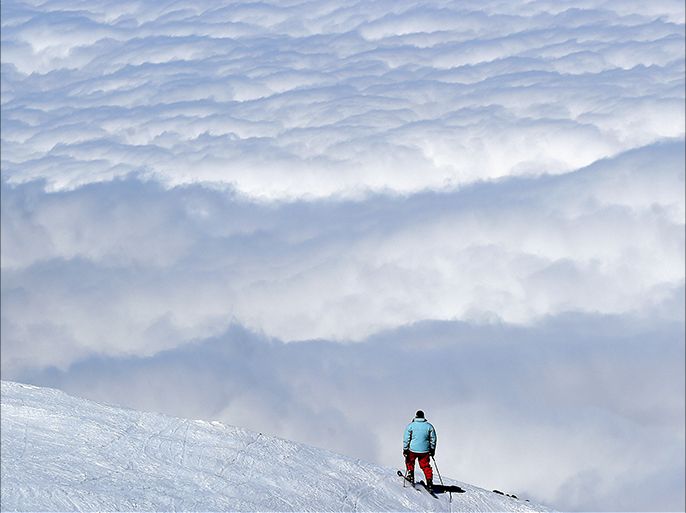 A skier stands on a slope at the Oukaimeden ski resort, about 80 kilometres south of the Moroccan capital Marrakech, on February 17 , 2015 . AFP
