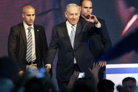 Israeli Prime Minister Benjamin Netanyahu gestures to supporters at party headquarters in Tel Aviv March 18, 2015. Netanyahu claimed victory in Israel's election on Tuesday after exit polls showed he had erased his center-left rivals' lead with a hard rightward shift that saw him disavow a commitment to negotiate a Palestinian state. REUTERS/Nir Elias (ISRAEL - Tags: POLITICS ELECTIONS)
