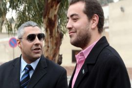 Canadian-Egyptian journalist Mohammed Fahmy (L) and his colleague Baher Mahmoud (R) stand outside a courthouse before their trial session in Cairo, Egypt, 23 February 2015. An Egyptian court on 12 February released two Al Jazeera journalists, Baher Mohammed and Mohammed Fahmy, pending their retrial. The court also ordered the release without bail of three students, thought to be Muslim Brotherhood supporters and convicted in the same case.