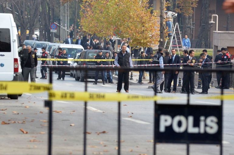 Security officials close a road leading to Turkish Prime Minister's office shortly after police subdued a man who was carrying a fake bomb in Ankara on November 21, 2031. Turkish police arrested a "mentally unstable" man carrying a fake bomb outside the office of Prime Minister Recep Tayyip Erdogan on Thursday, officials said, causing a security scare in the capital. Local television stations had initially reported that police had shot and wounded the suspect but officials and witnesses later said they wrestled him to the ground and only fired shots in the air. AFP PHOTO /ADEM ALTAN