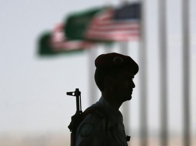 A Saudi policeman stands guard during President Barack Obama's departure in Riyadh, Saudi Arabia, Saturday, March 29, 2014. (AP Photo/Hasan Jamali)