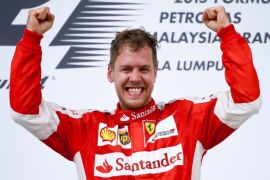 German Formula One driver Sebastian Vettel of Scuderia Ferrari celebrates after winning the 2015 Formula One Grand Prix of Malaysia at the Sepang Circuit in Sepang, Malaysia, 29 March 2015.
