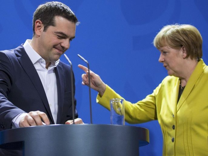 German Chancellor Angela Merkel and Greek Prime Minister Alexis Tsipras leave after addressing a news conference following talks at the Chancellery in Berlin March 23, 2015. Tsipras, pressing for cash to keep his country afloat, began talks with Merkel on Monday after Berlin ruled out any breakthrough in differences with the euro zone over Athens's international bailout. REUTERS/Hannibal Hanschke TPX IMAGES OF THE DAY